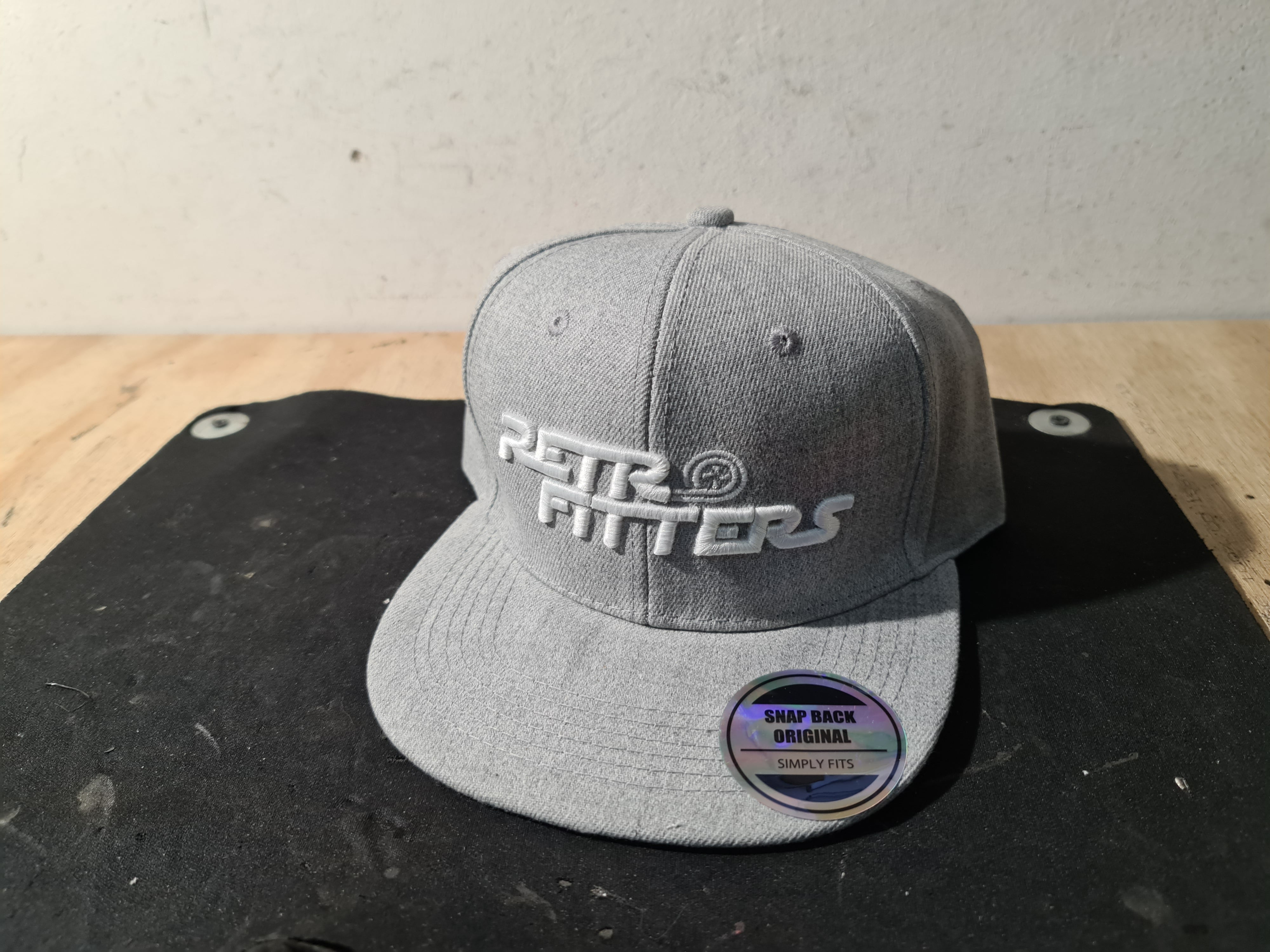 Retrofitters snapback flatpeak caps